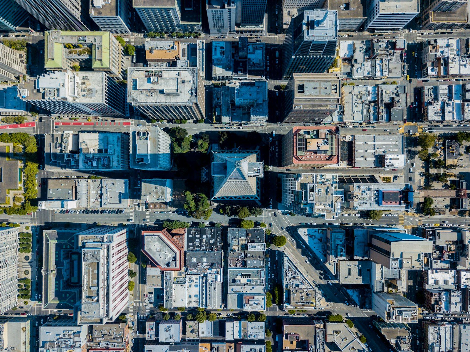 Aerial view of a mixed urban landscape with apartment buildings, warehouses and retail centers