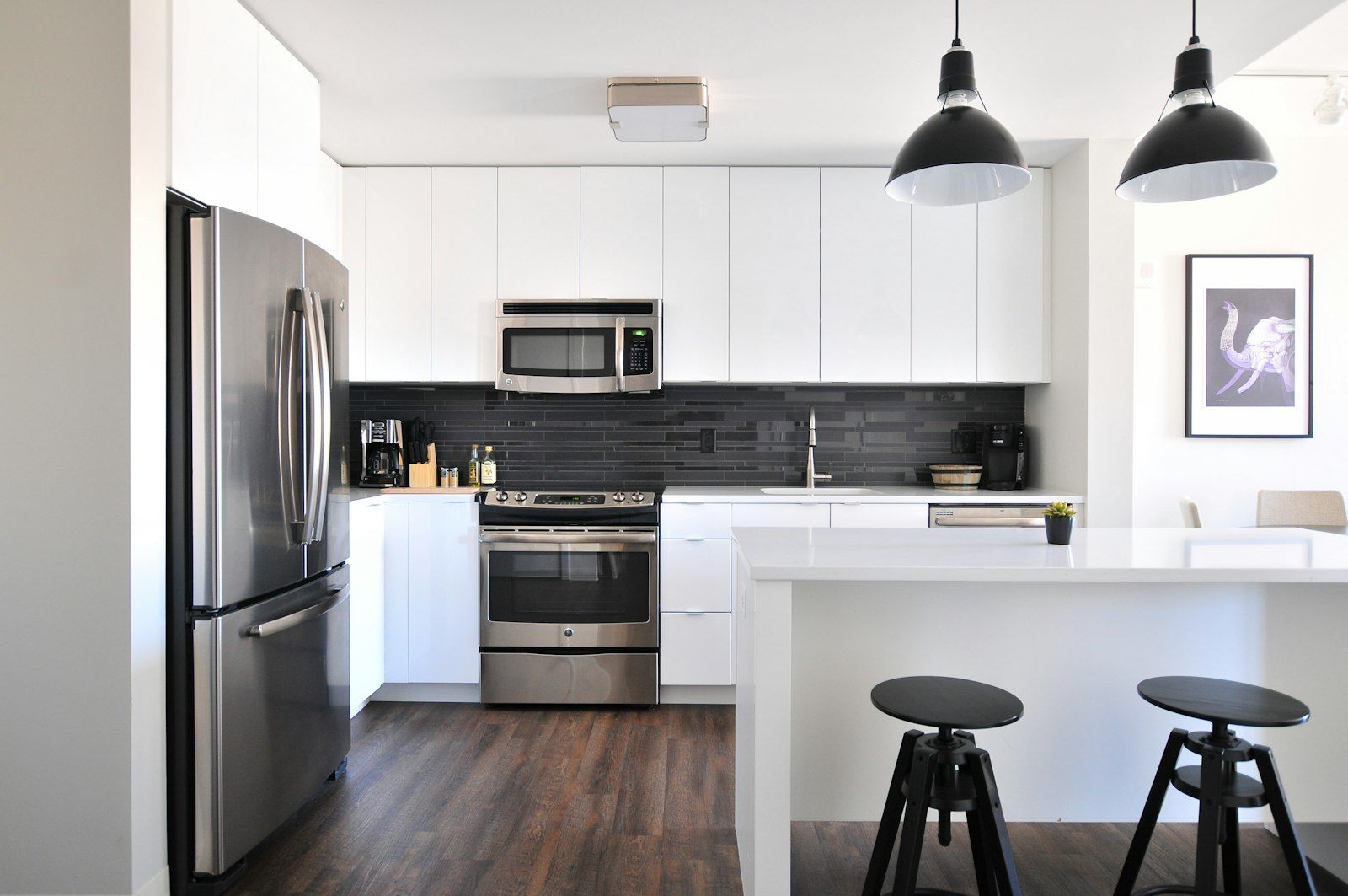 Renovated apartment kitchen with new cabinets and countertops during a building upgrade